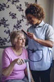 Carer Brushing Patients Hair